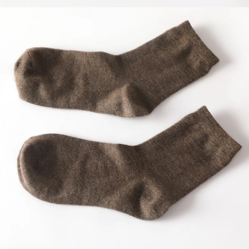 Stylish cashmere socks paired with winter attire, highlighting their versatility.