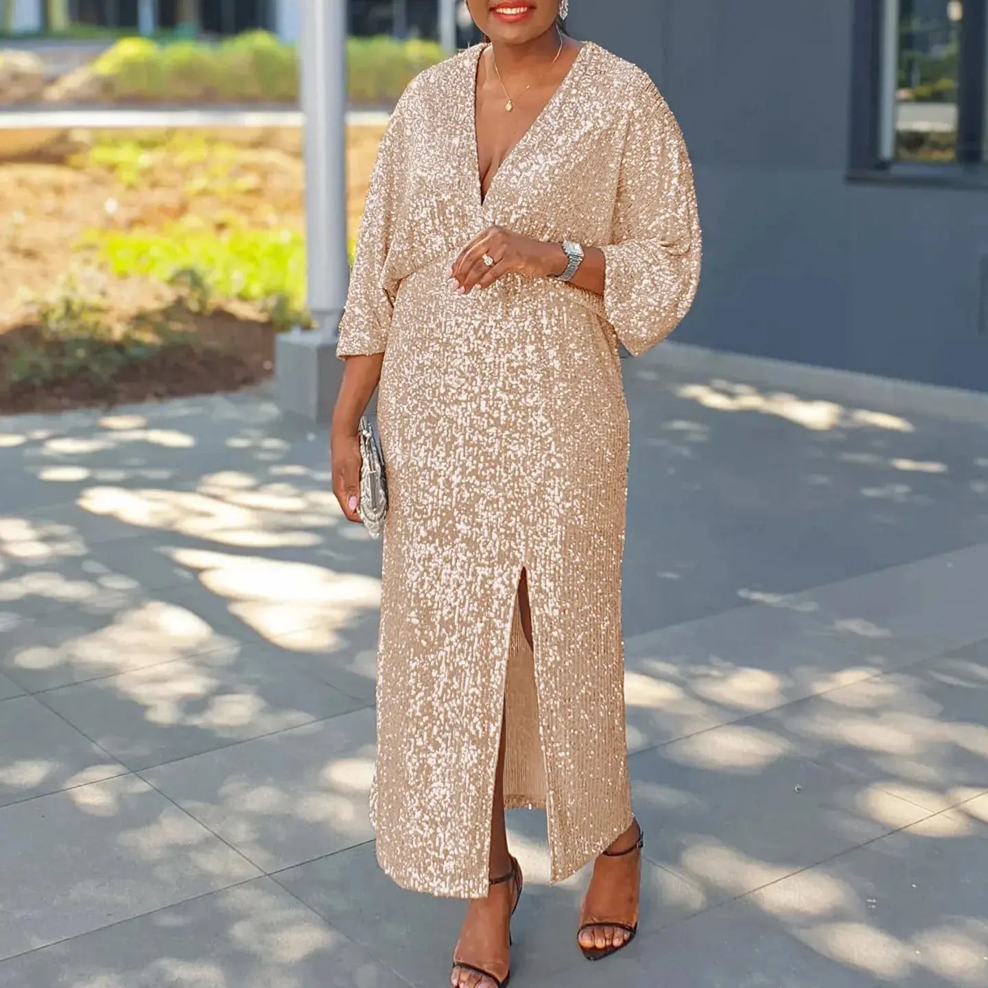Flat lay of the Captivate the Night sequined gown, highlighting its luxurious polyester and elastane blend.