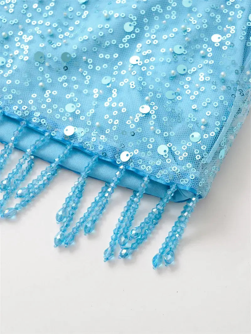 Detail shot of sequins on the Pearl Fringe Halter, capturing the sparkle for evening events.