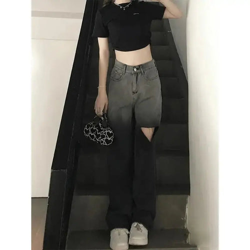 Close-up of delicate rips on high-waist jeans, showcasing modern style and breathable fabric.