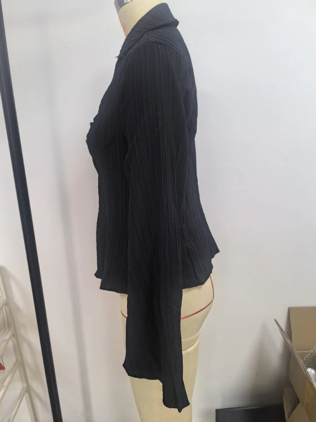 Sophisticated button-down peplum top with sculpting waistline and timeless collar design