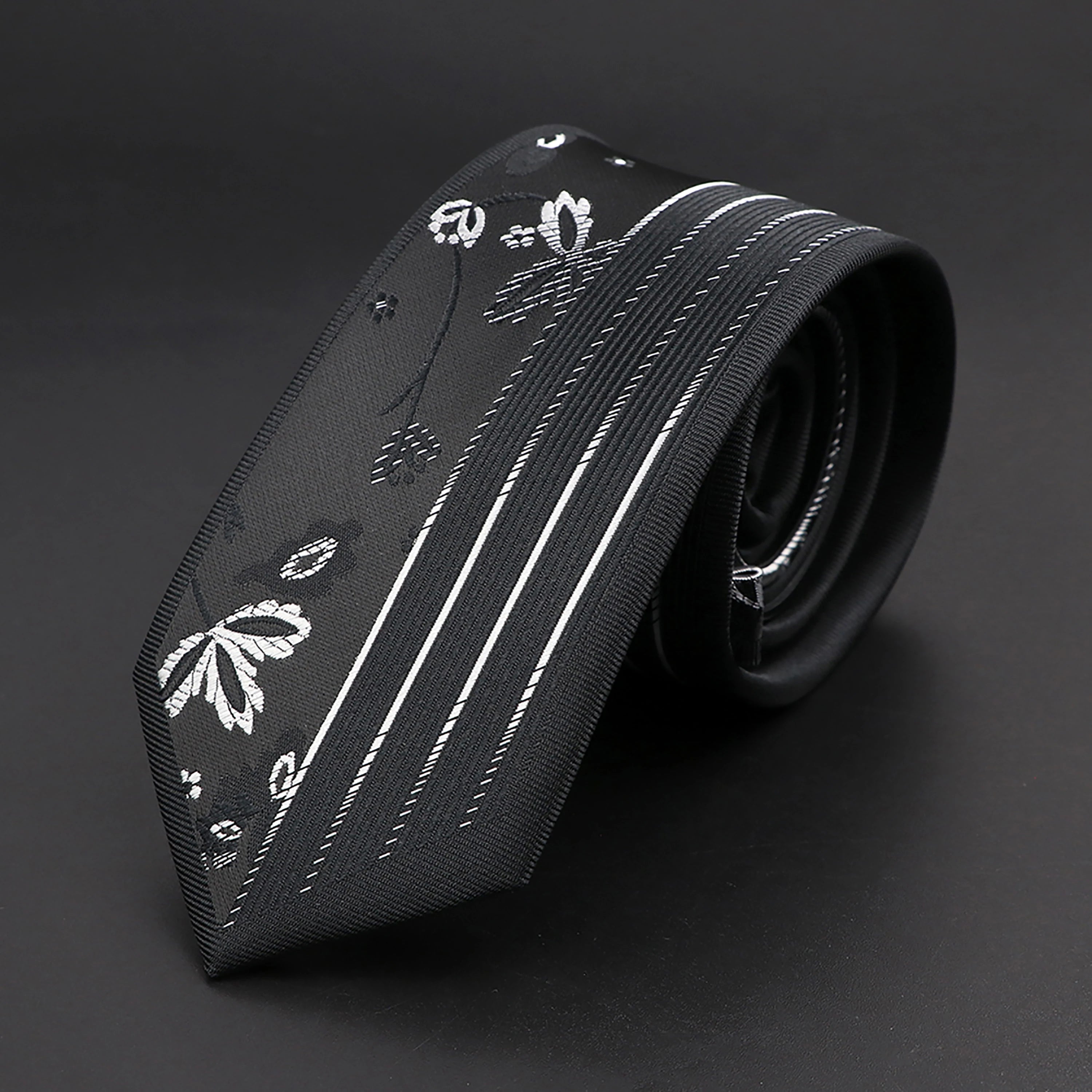 Sophisticated men's tie in deep purple and black, perfect for formal events.