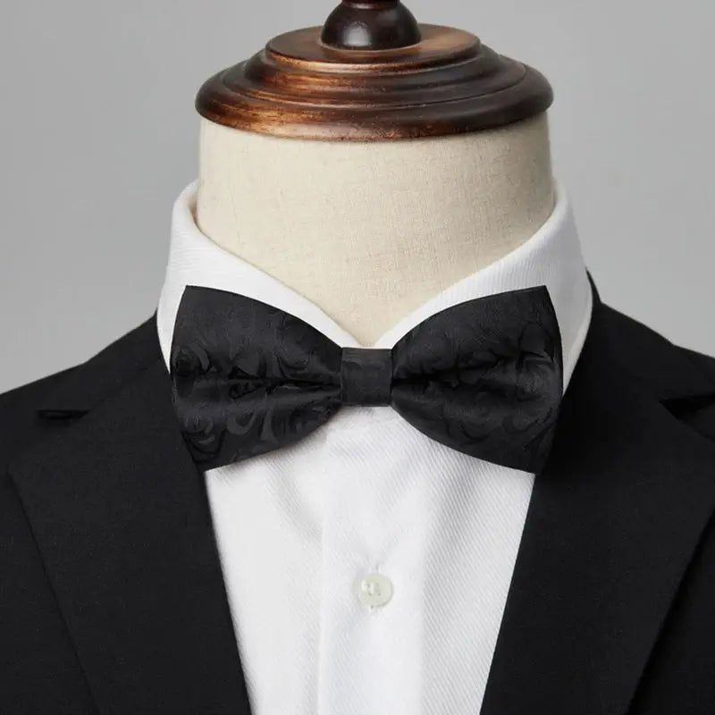 Sleek black bow tie made of high-quality polyester with a smooth matte finish.