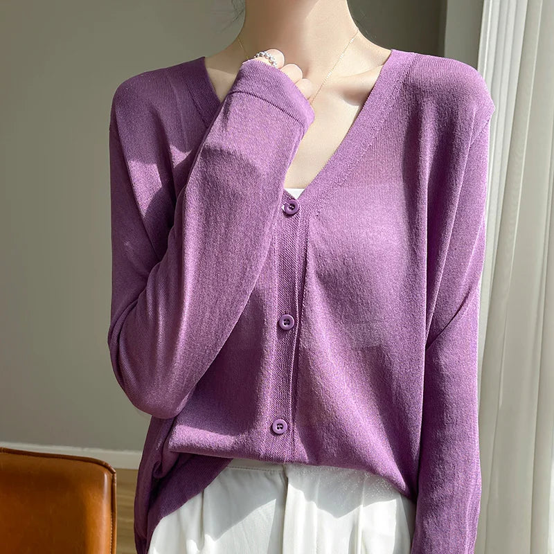 Model enjoying coffee while wearing the Breeze Whisper Cardigan, perfect for casual outings.