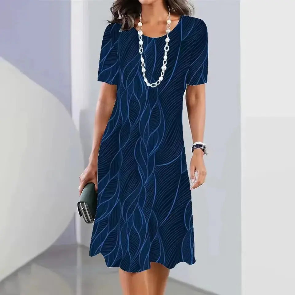 Back view of the Summer Breeze Midi Dress, highlighting its mid-calf length and loose silhouette.
