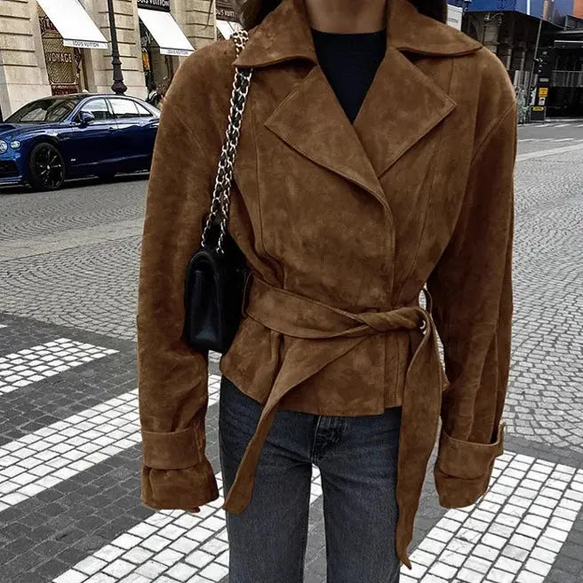 Flat lay of the French suede jacket with autumn accessories, perfect for transitional seasonal styling.