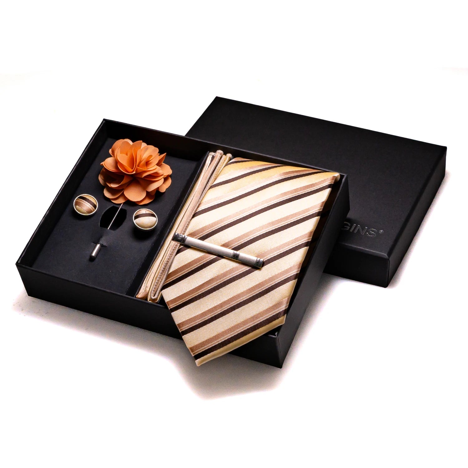 Geometric patterned silk tie ensemble with matching handkerchief and cufflinks in warm tones