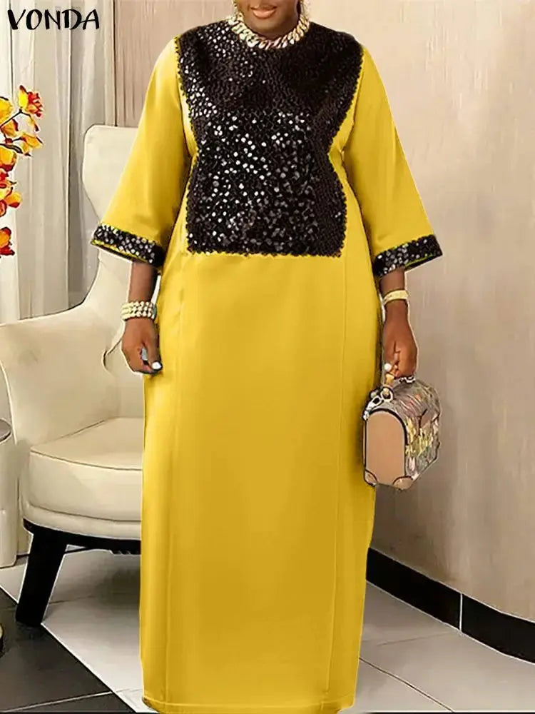 Elegant ankle-length dress featuring three-quarter sleeves and a natural waistline.