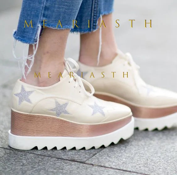 Black wedge sneakers with slip-on design and durable rubber outsole