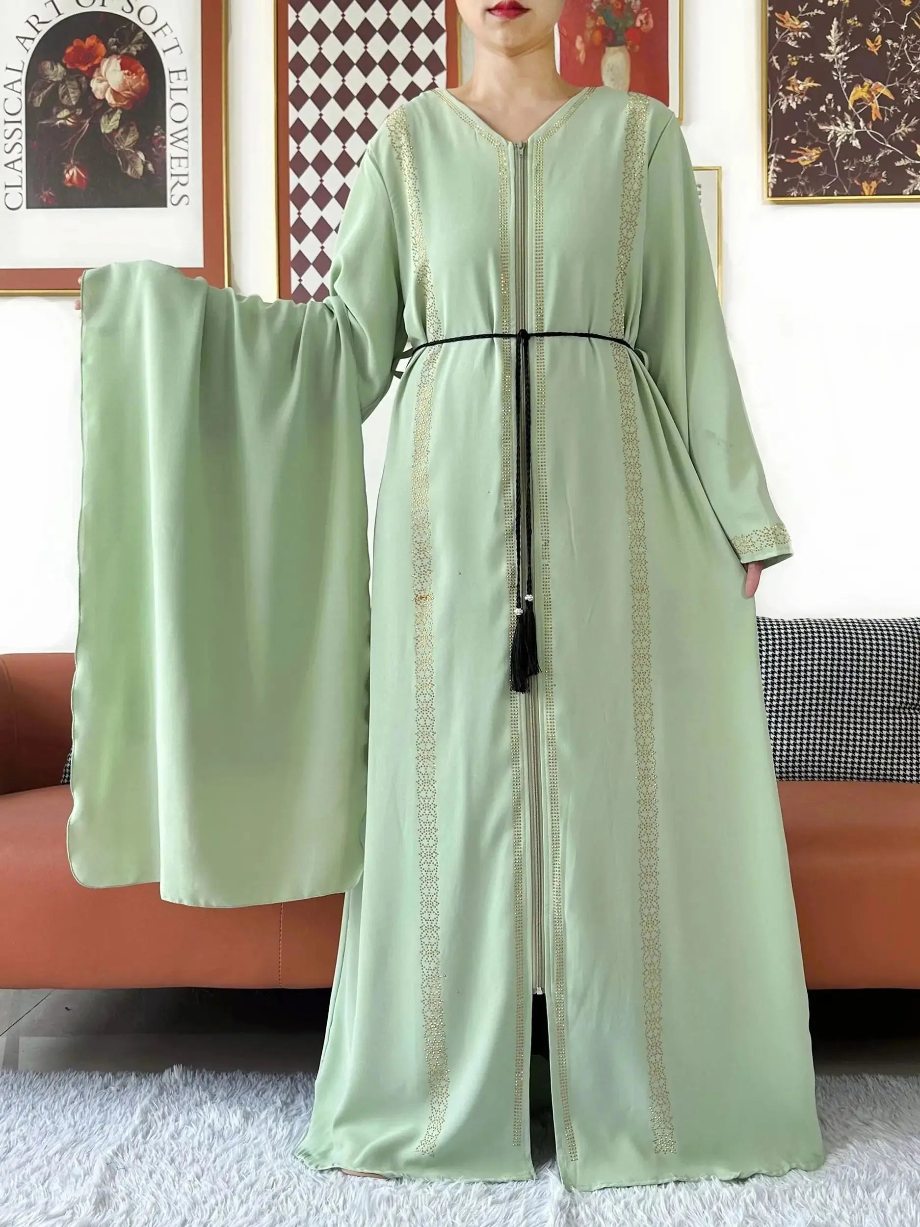 Detail shot of the full-length zipper on the abaya, combining practicality with elegance.