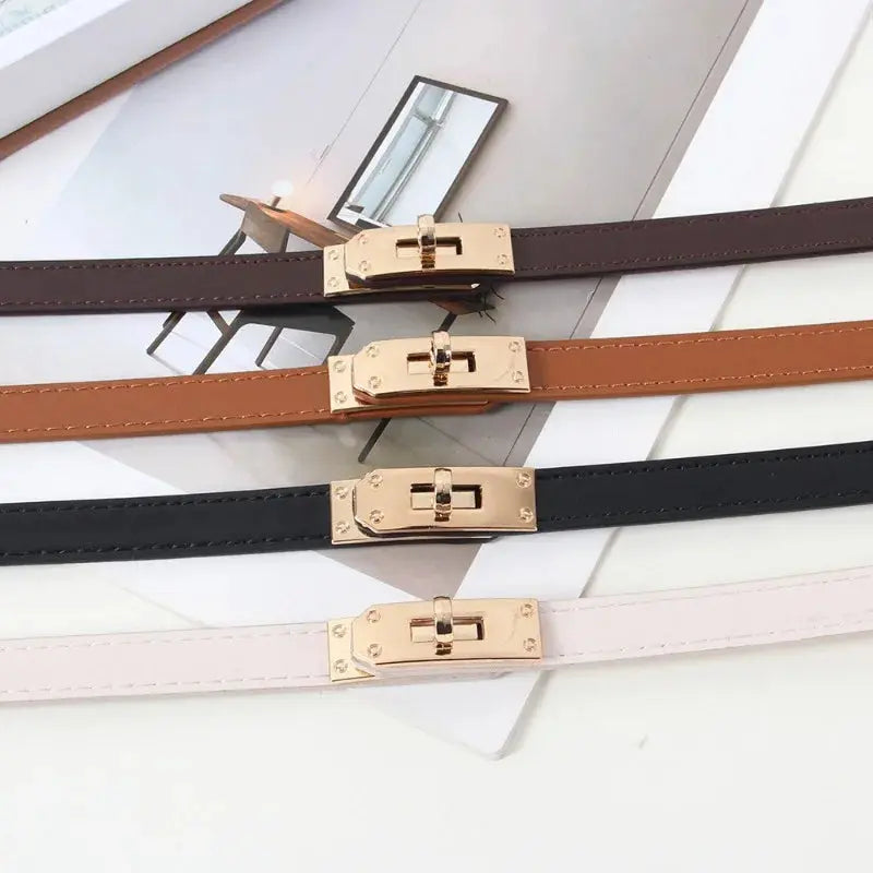 Whisper of Elegance Belt displayed on a hanger, emphasizing its sophisticated style and delicate buckle detail.