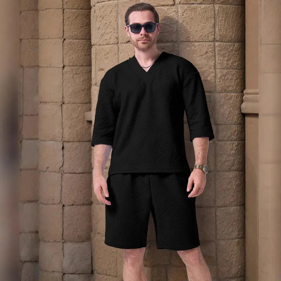 Close-up of jacquard texture on V-neck T-shirt, showcasing breathable fabric.