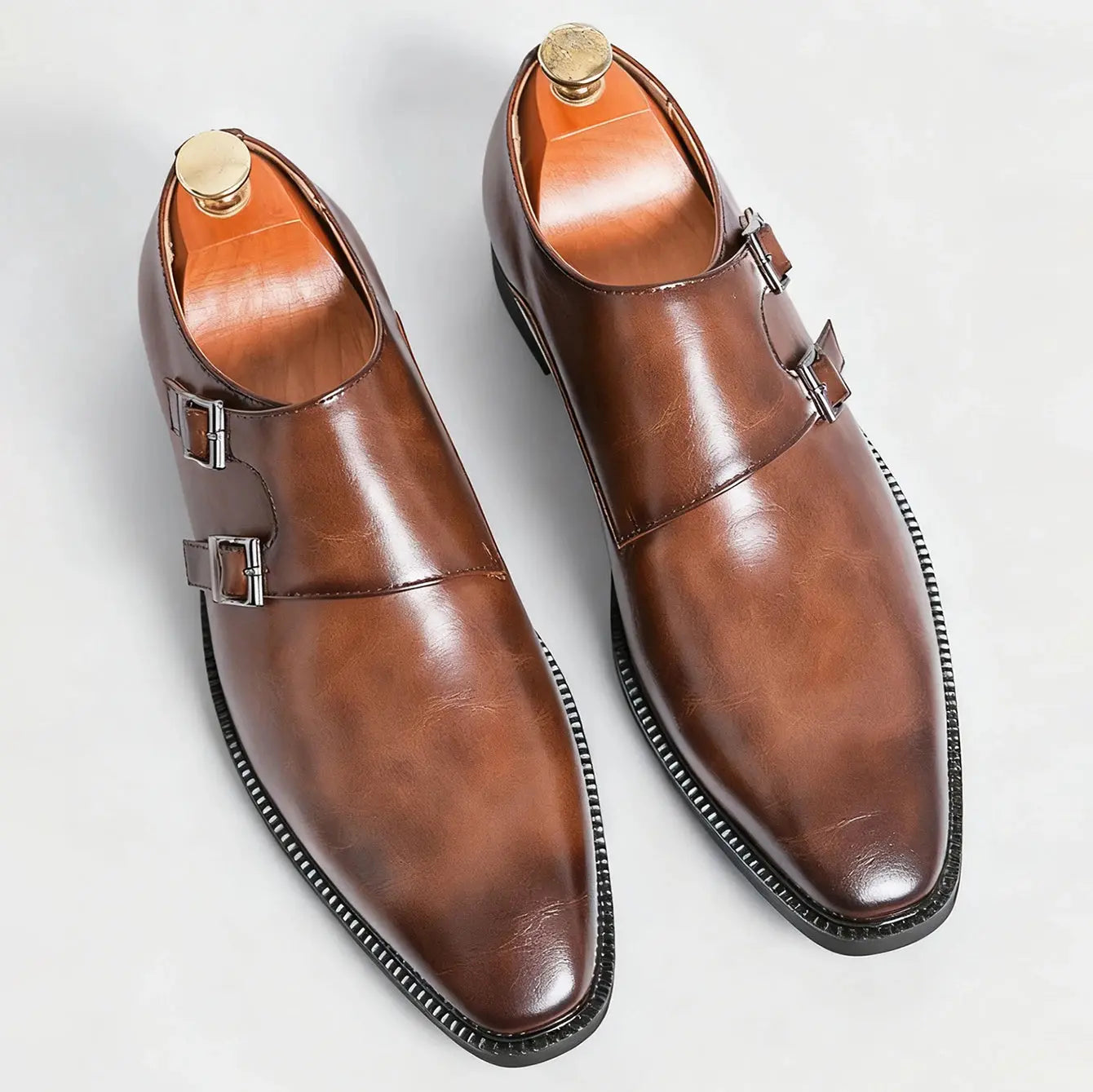 Monk strap leather shoes paired with formal attire, perfect for weddings and soirées.
