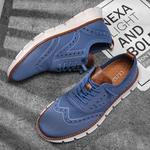 Side view of slip-on brogue sneakers featuring traditional wingtip design and modern mesh construction