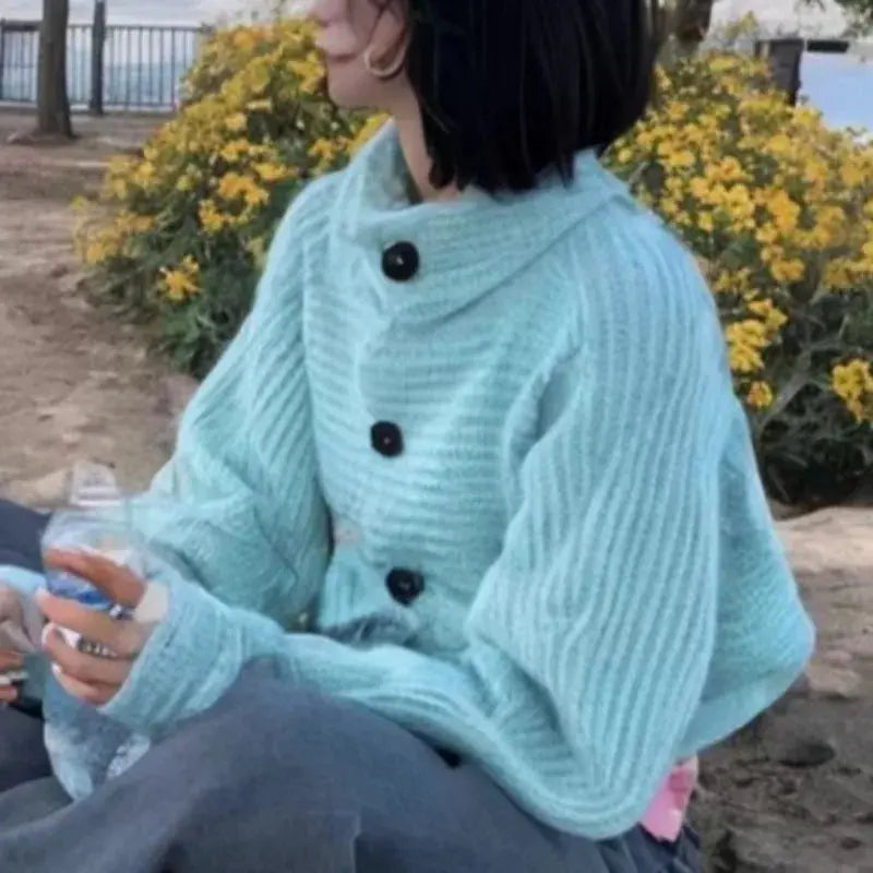 Whisper-Soft Cardigan draped over a chair, demonstrating its versatility for casual and chic outfits.