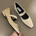 Top view of ballet flats displaying the roomy fit and premium faux suede material.