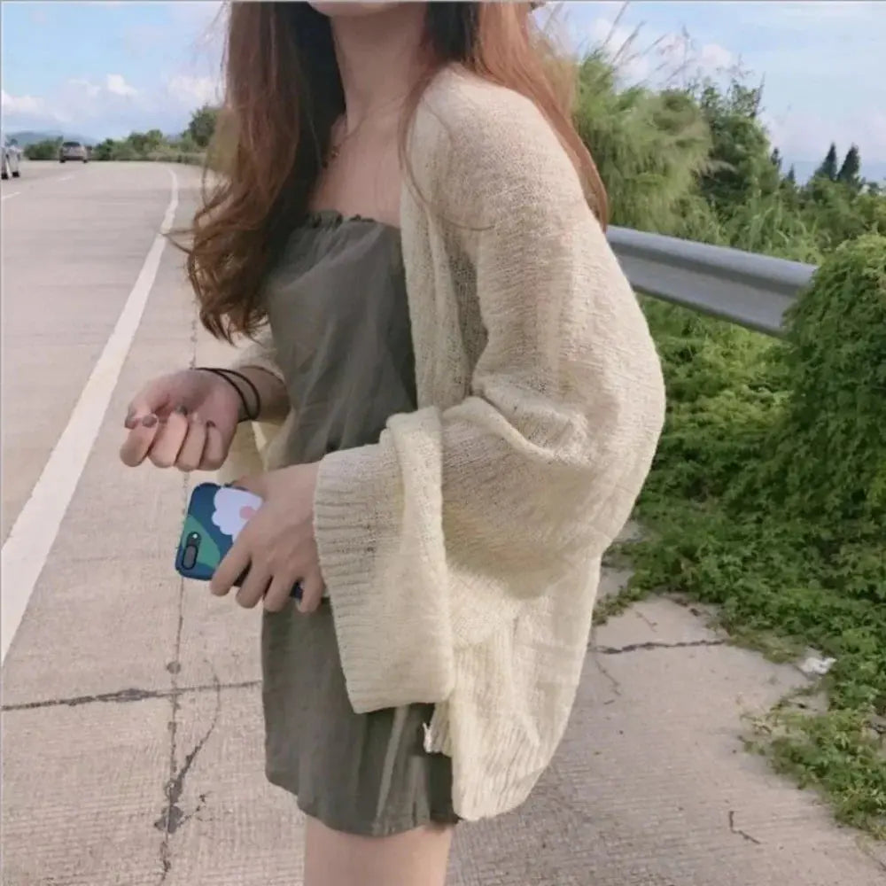 Lightweight cotton Summer Breeze Knit Cardigan in soft beige, perfect for summer evenings.