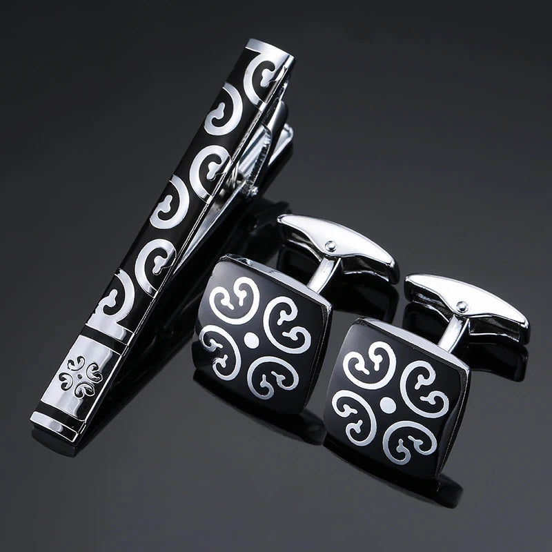 Sophisticated tie clip adorned with crystal and rose metal patterns, enhancing style.