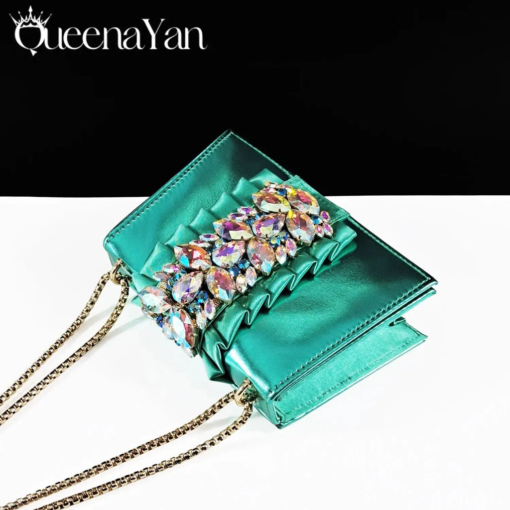 Close-up of emerald heels showcasing delicate rhinestone details.