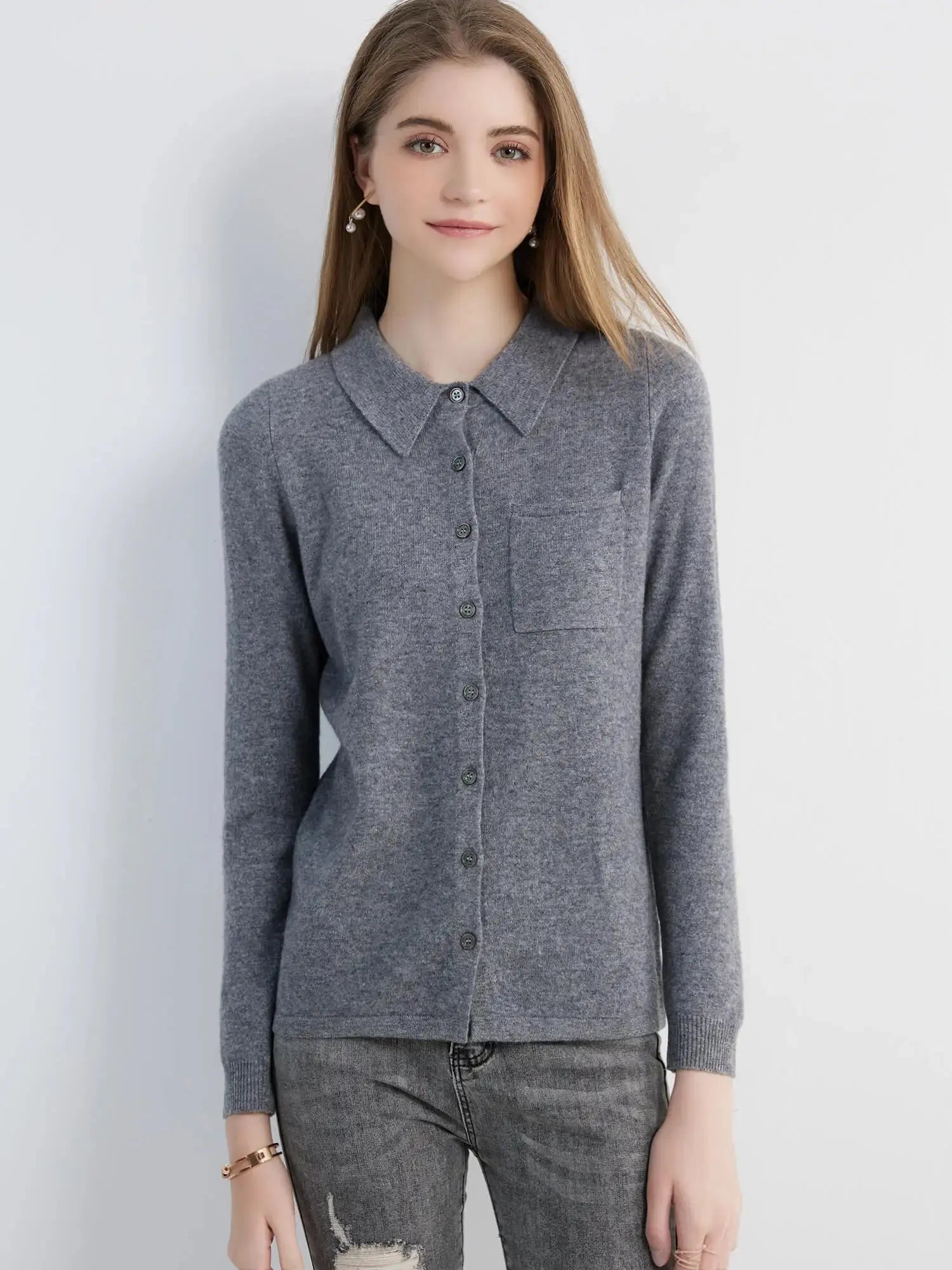 Whisper-Soft Merino Cardigan draped over a cozy chair, perfect for autumn evenings.