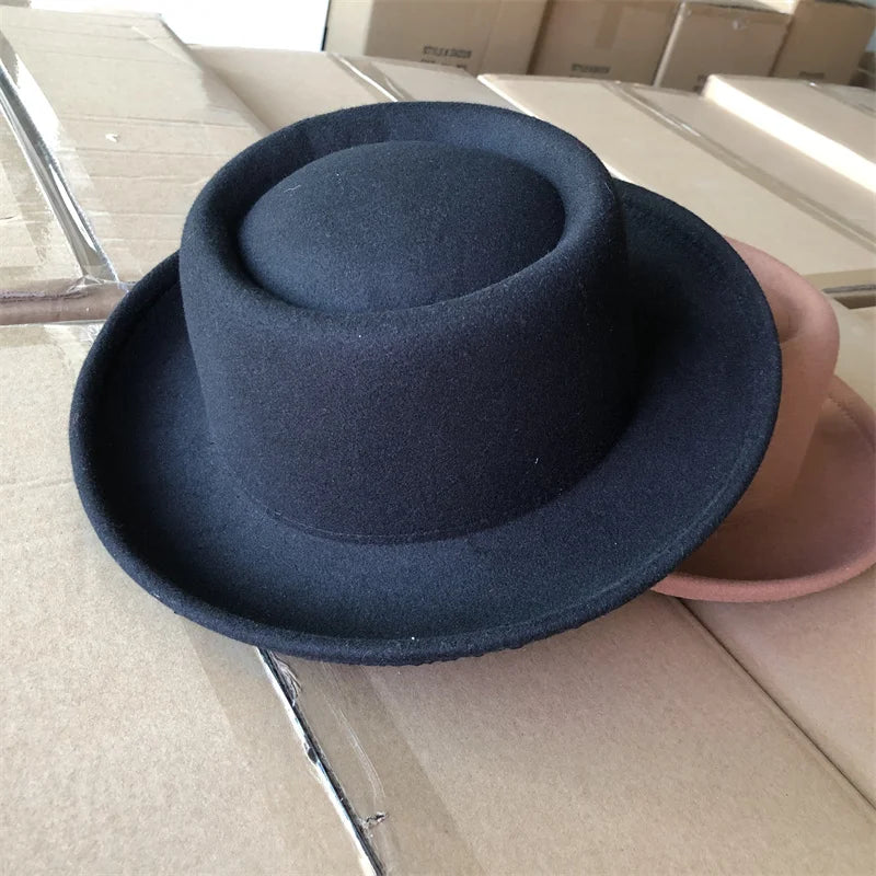 Fedora resting on a vintage jazz record for a thematic touch.