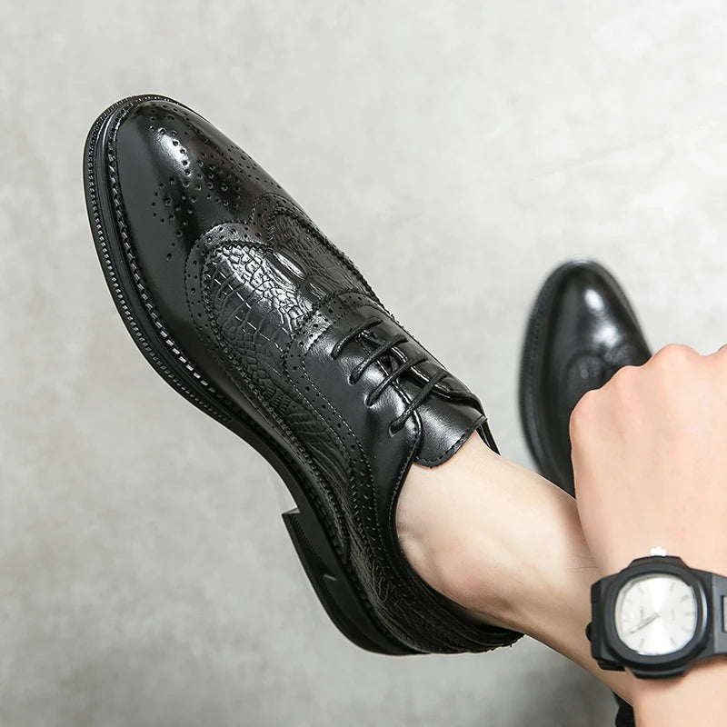 Close-up of handcrafted brogue wingtip shoes showing intricate perforation detail and quality leather