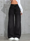 Flat lay of high-waist jeans paired with casual chic accessories, perfect for versatile fashion.