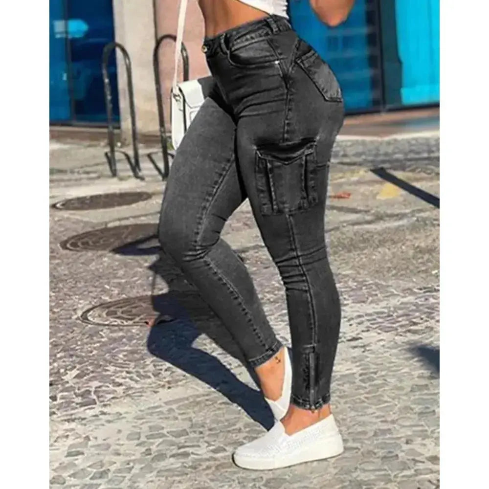 High-waist jeans in a subtle distressed wash, perfect for casual chic looks.