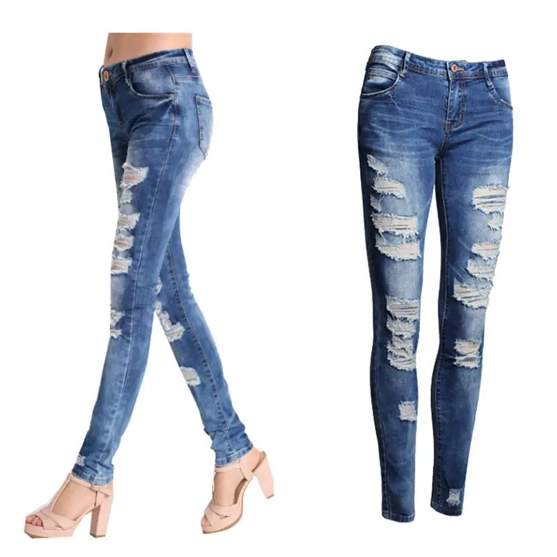 Close-up of distressed red denim fabric highlighting unique rips and bleached details.