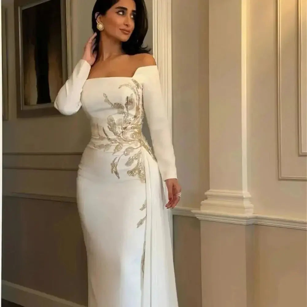 Close-up of satin fabric showcasing intricate beading on the off-shoulder design.