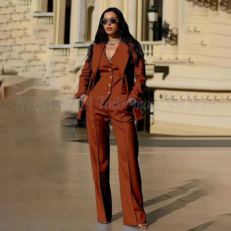 Navy blue tailored trousers styled with a chic top.