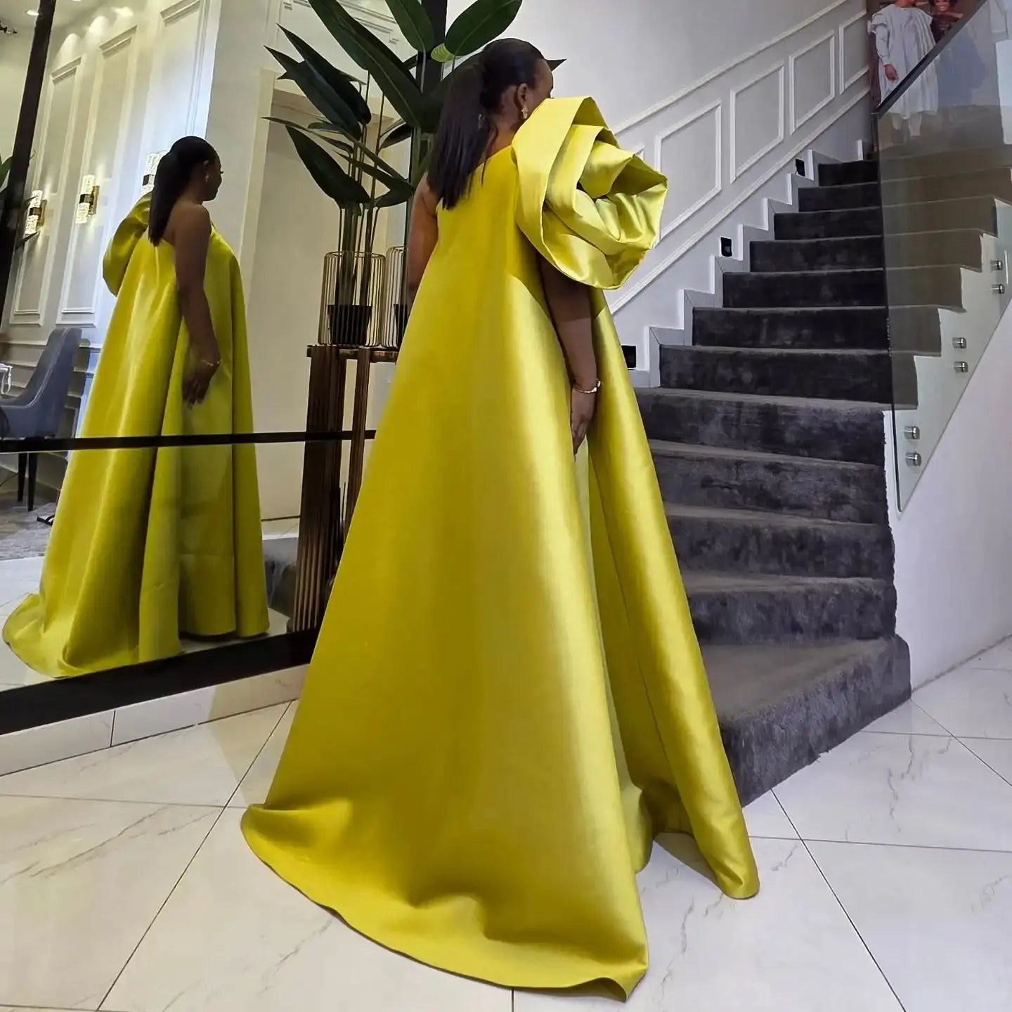 Back view of the one-shoulder enchanting gown, highlighting the elegant silhouette and built-in support.