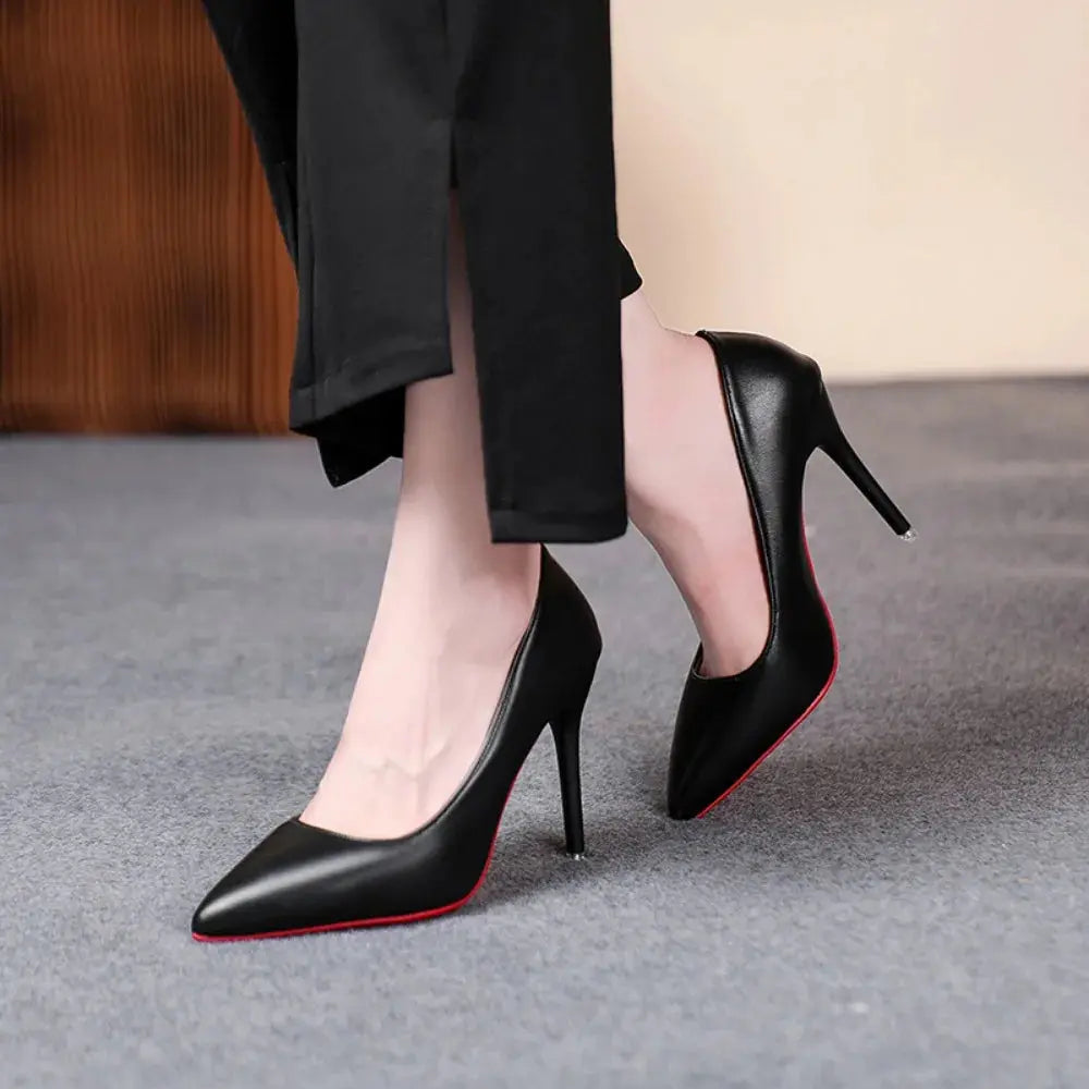 Back view of chic black heels, emphasizing their elegant silhouette.