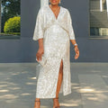 Side angle of the Captivate the Night gown, showcasing the bold high split and comfortable fit.