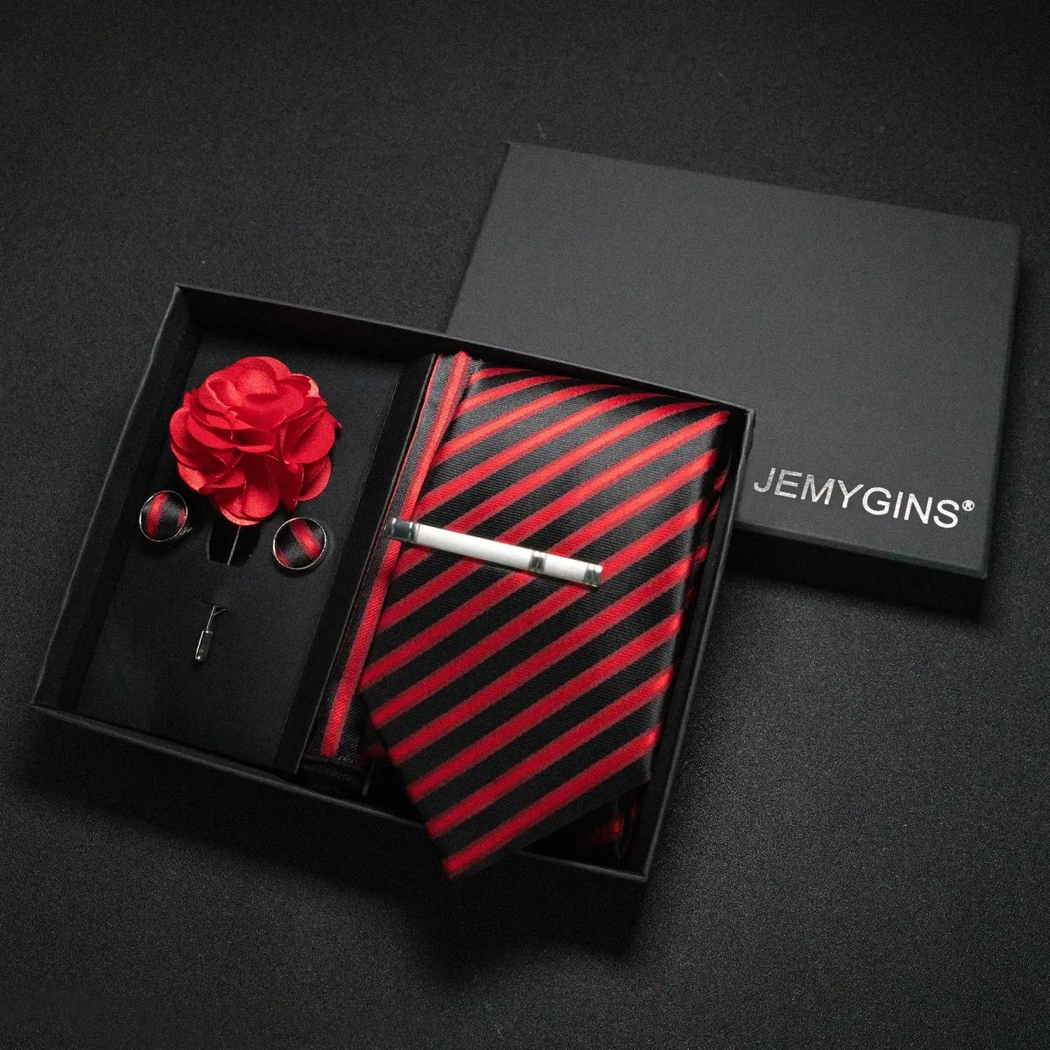Wine-red paisley tie set in a gift box with a ribbon.