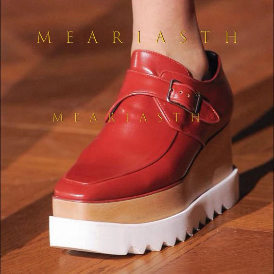 Platform wedge sneakers in leather showing side profile and elevated sole