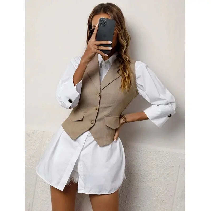 Back view of the tailored vest highlighting its sleek silhouette and professional fit.