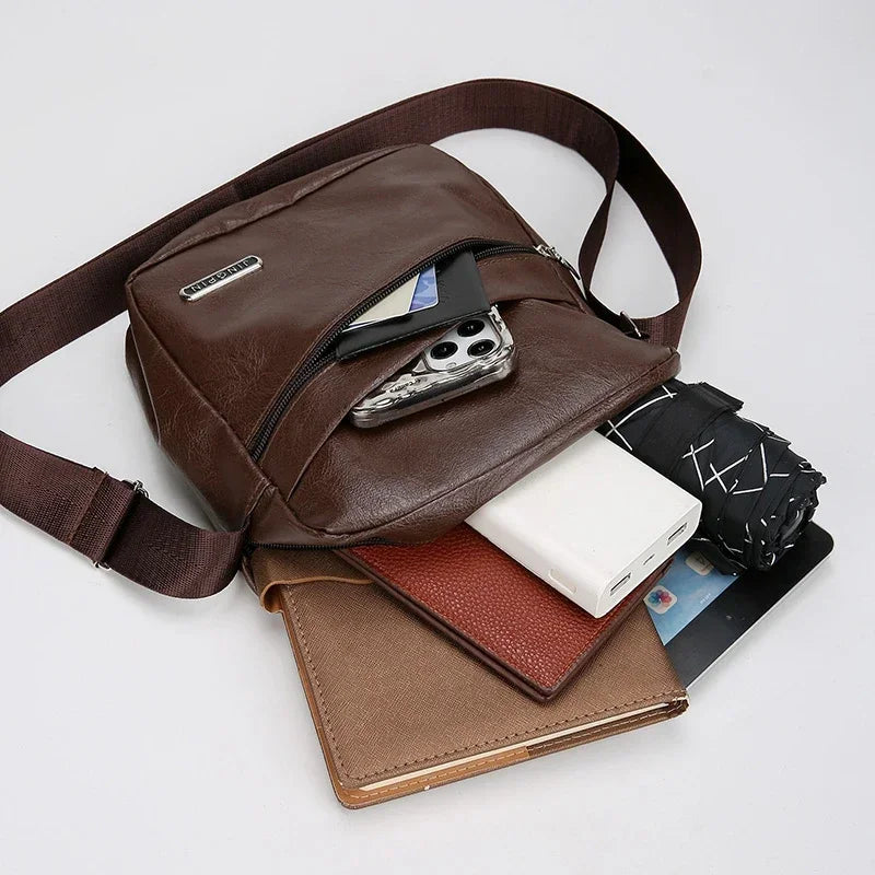 Waterproof messenger bag showing spacious bucket-style interior with organized compartments for laptop and essentials