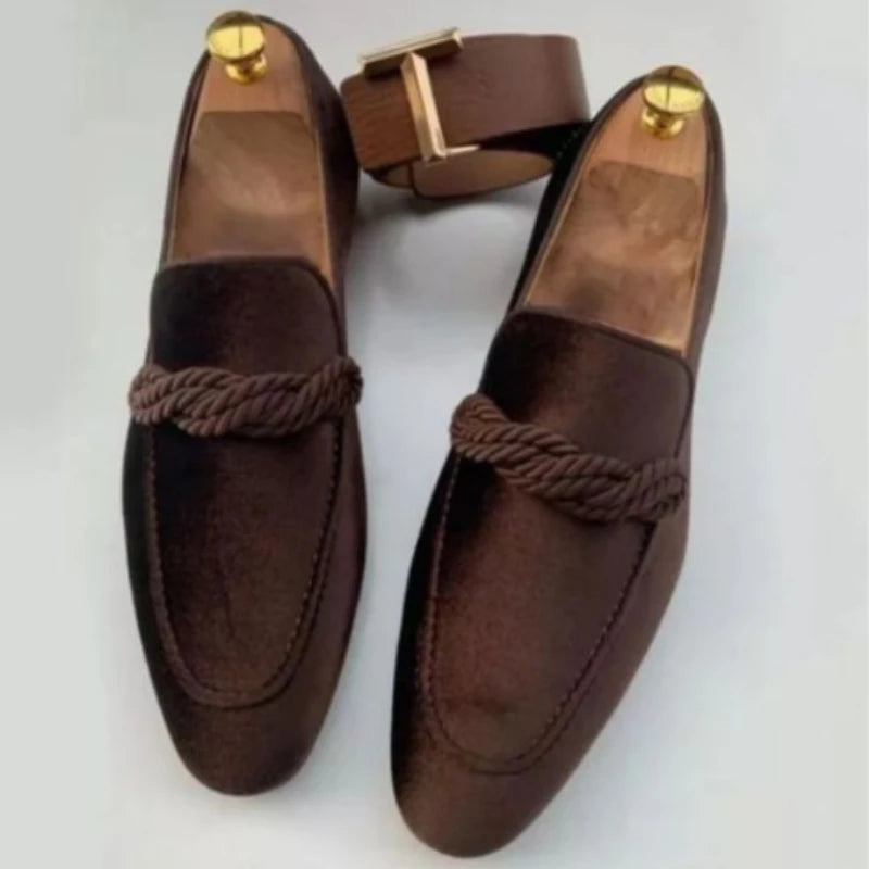 Men's fringe loafers showcasing bright fringe detail and patent finish.