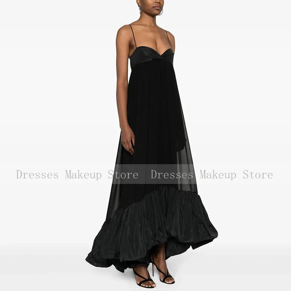 Elegant black satin gown showcasing adjustable spaghetti straps and flattering fit.
