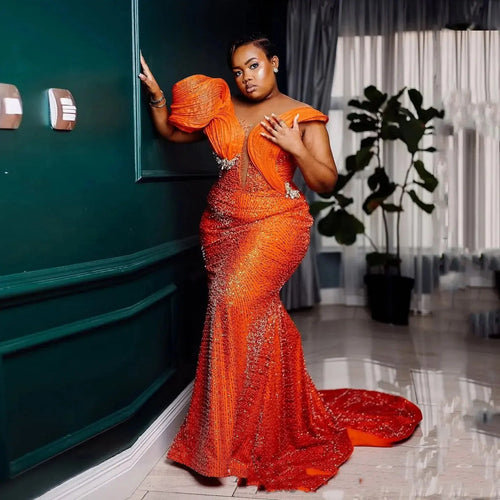 Sunlit Glow Mermaid Gown in shimmering orange with intricate beading and sequins.
