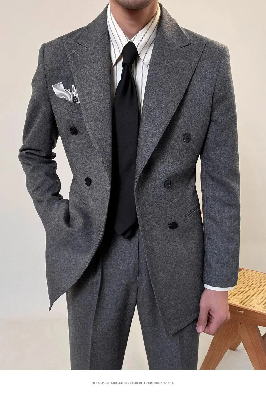 Double-breasted closure of the men's power suit, showcasing a sleek and stylish design.