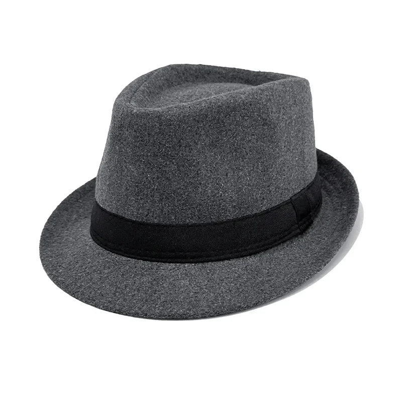 Flat lay of the charcoal fedora with accessories, showcasing its signature fashion appeal.