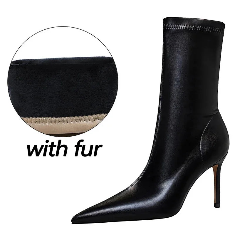 Sleek pointed toe boots with structured mid-calf height design