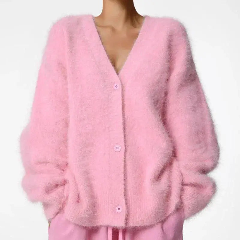 Elegant V-neck cardigan with subtle button detail, enhancing casual autumn outfits.
