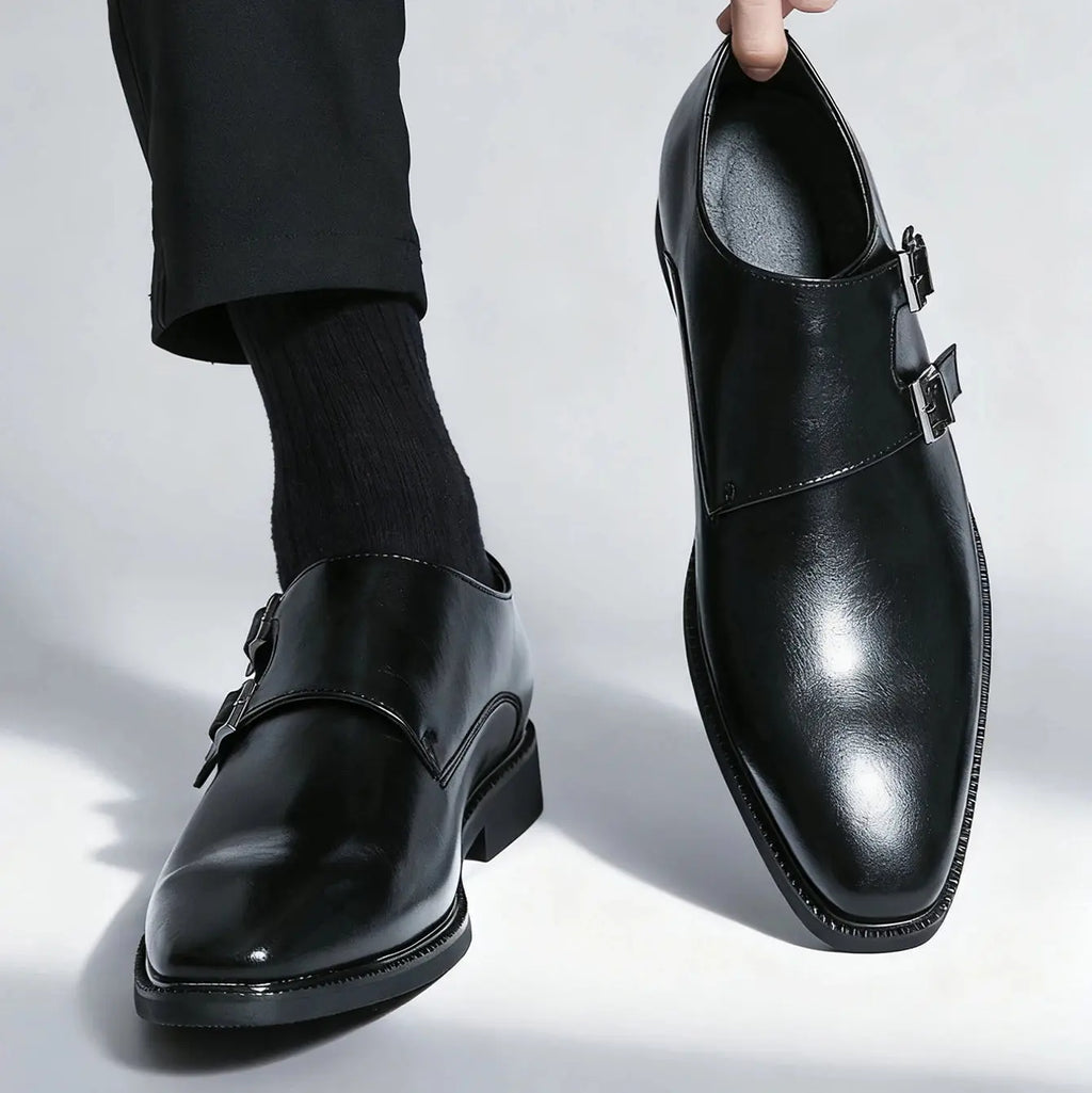 Monk strap leather shoes displayed on a wooden surface, emphasizing their sophisticated style.