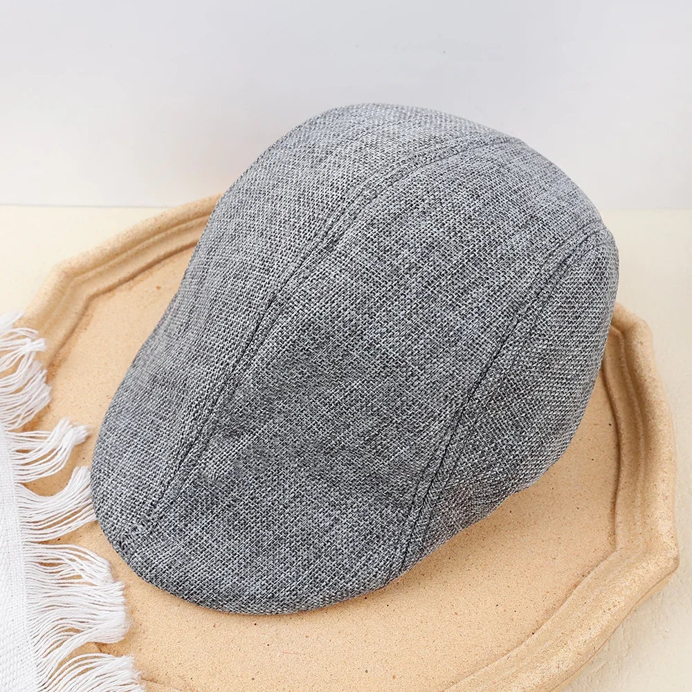 Cotton denim beret featuring classic peaked design and superior comfort