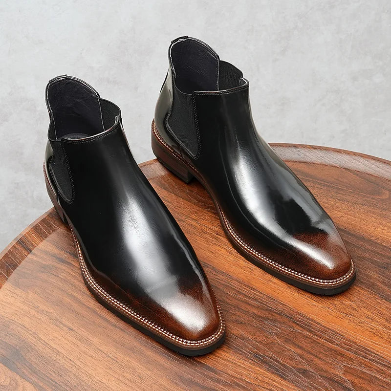 Pair of executive leather Chelsea boots in black showing slip-on convenience and tailored fit