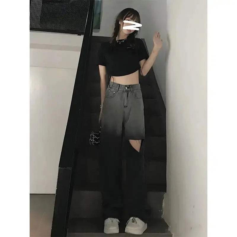 Model wearing breezy high-waist ripped jeans, styled for brunch with a casual tee and chic accessories.
