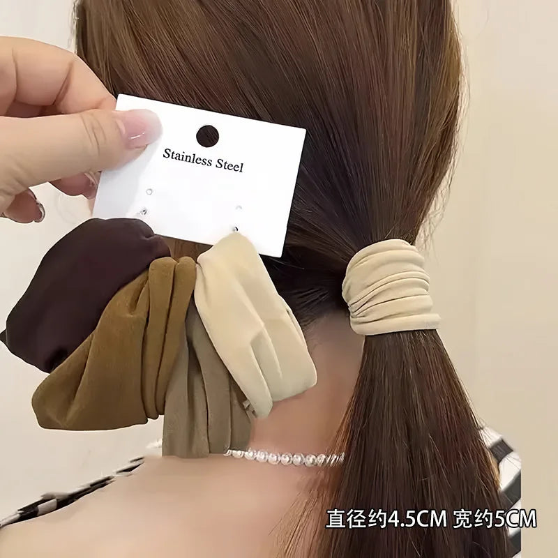 Year-round satin hair ties working beautifully on curly and straight hair